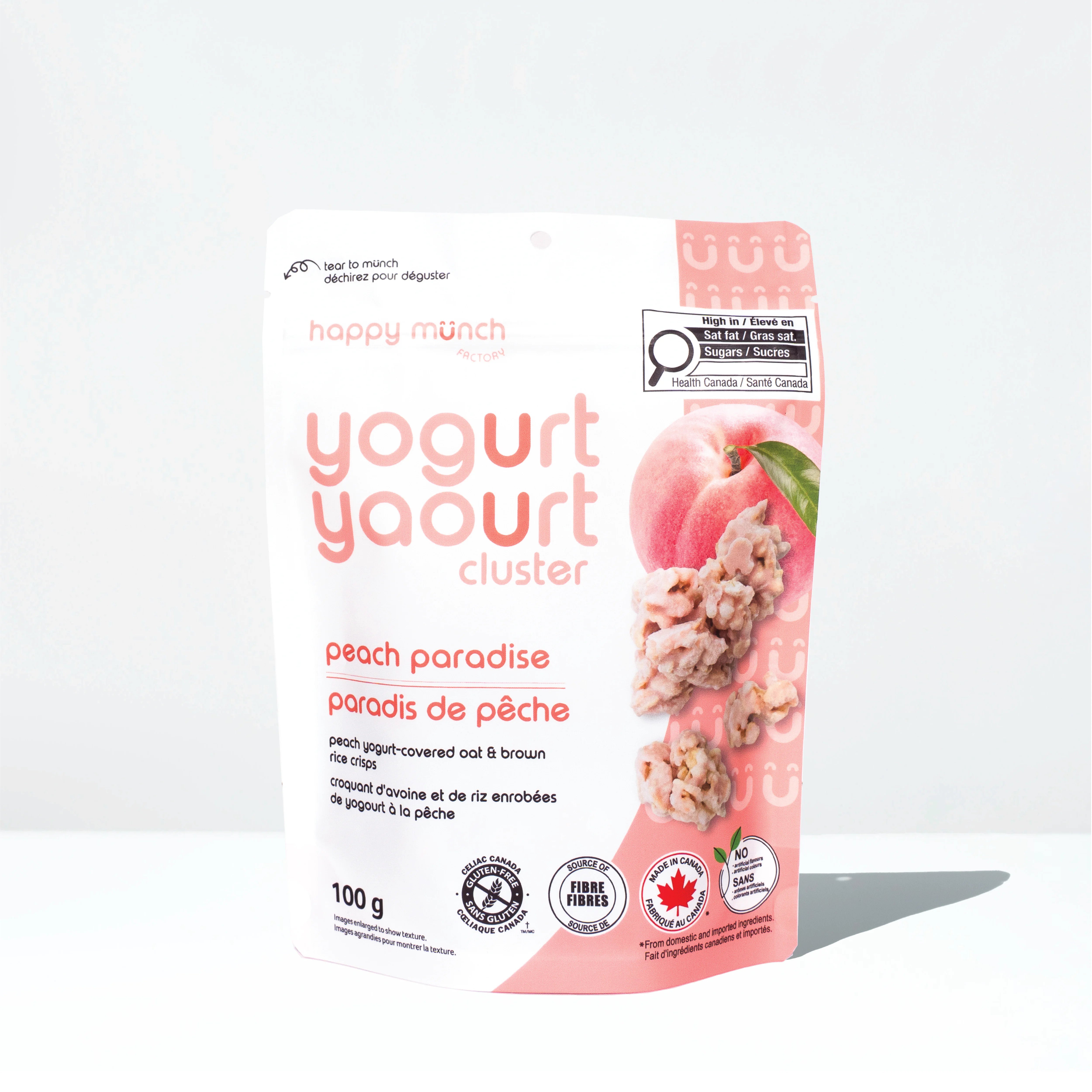 Front of Happy Munch Peach Paradise yogurt cluster packaging on a white background