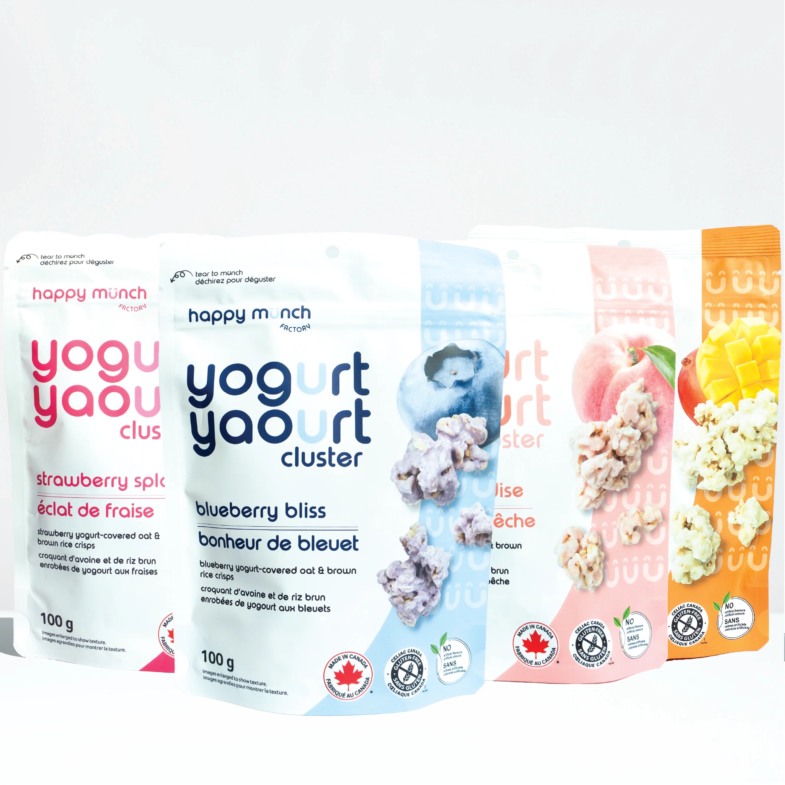 Four packages of happy munch yogurt products on a white background