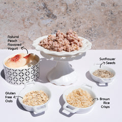 Happy Munch Peach Paradise Clusters on a plate with ingredients in blows